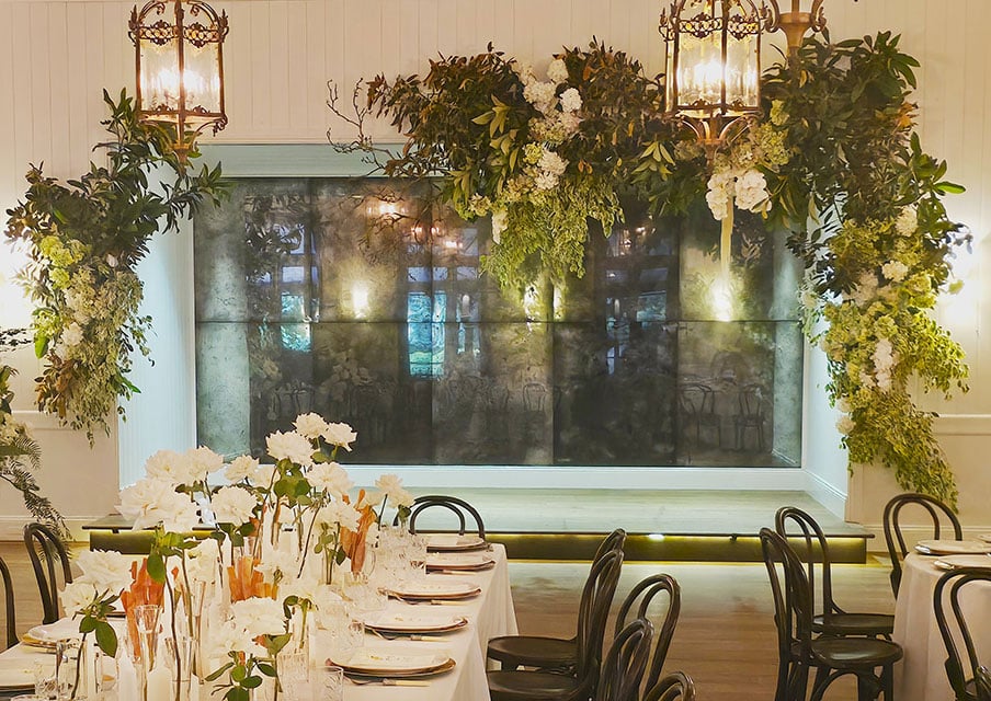 Stage-Floral-Installation-Greenery-Hydrangeas-Carriage-Lanterns-Dancefloor-Jaspers-Berry