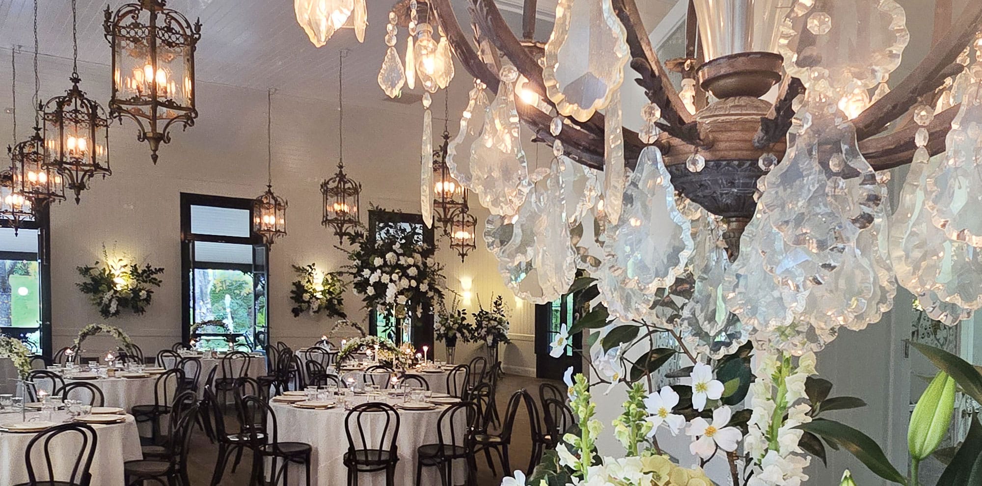The-Orangery-Marble-Foyer-Crystal-Chandelier-Carriage-Lanterns-Bentwood-Chairs-Jaspers-Berry-South-Coast-NSW