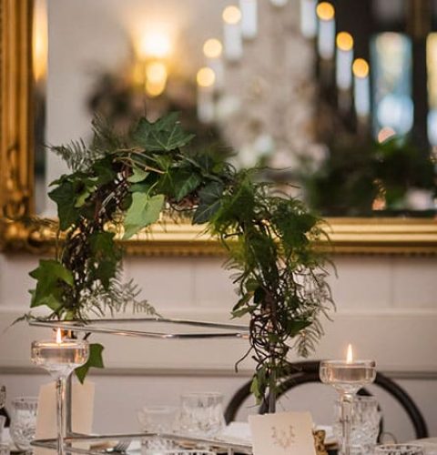 Platter-Arches-covered-with-Greenery-Tall-Tealight-Candles-Shared-Platters-The-Orangery-Jaspers-South-Coast